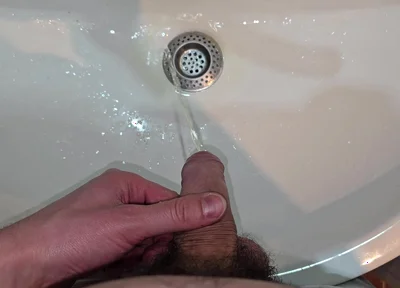 Hairy Cock Peeing Into the Sink in Bathroom with a Strong Stream