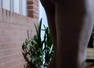 In the Doorway in a Thong and with an Anal Plug