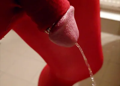 Pissing at Home in Red Legging with Penis Sleeve