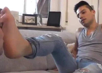 Young alpha feet licking