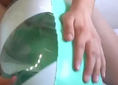 Playing with a Green and White Swimring