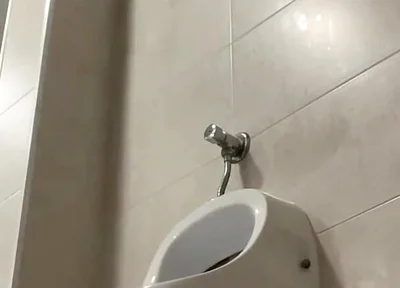 Amateur Twink Boy and Older Guy Caught Having Risky Fun in the Pool's Public Toilets