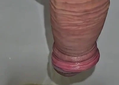 Male Peeing Into the Toilet