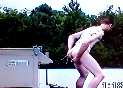 Crossdresser Riding a Giant Dildo on a Roof Top