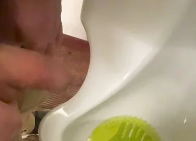 Amateur Redhead Guy Caught Pissing in a Public Toilet's Urinal - He Then Quickly Plays with His Cock Before Leaving