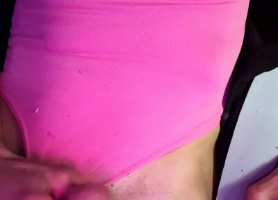 Crossdresser Michelle Wearing Pink Bodysuit While Playing with Cock