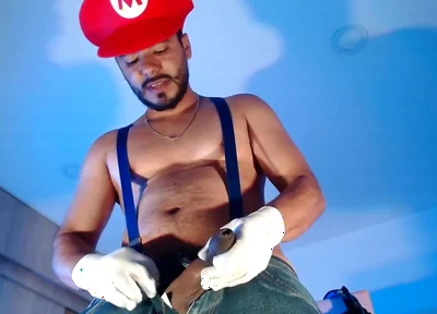 Dressed as Mario Bros Playing with His Plumbing Tool