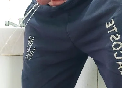 A Well-endowed Brazilian Man Urinating and Showing His Thick Penis to His Female Friends.