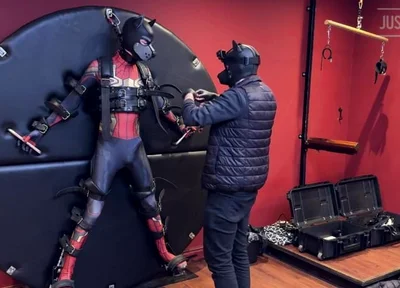 Pup Twink Dressed as Spider-man Strapped to the Bondage Wheel and Milked
