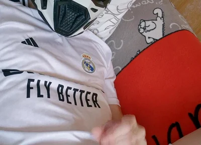The Guy Is Wearing a Soccer Uniform and Mxhelmet with a Morning Cum
