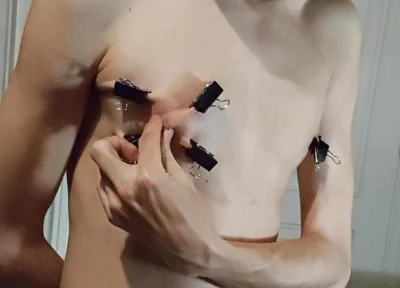 Twink Playing with Binder Clips