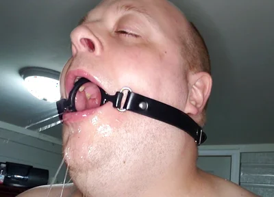 Deepthroating a 7 Inch Dildo with Mouth Gag Ring
