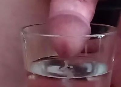 Cumming in a glass of hot water