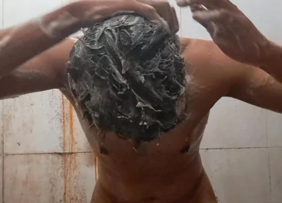 Exotic Skinned Adult Man Taking a Bath in the Afternoon