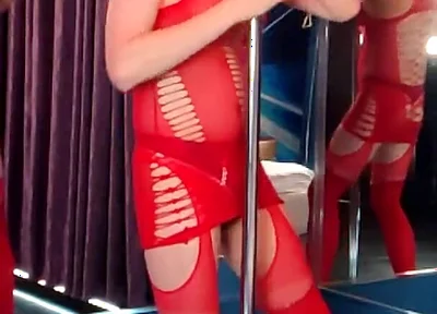 She Dances in a Red Bodysuit, as if Someone Is Going to Take Her Right at the Pylon