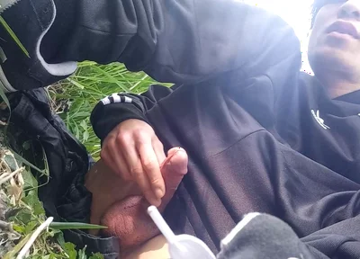 Gay boy Jon Arteen, wearing adidas tracksuit Campus sneakers, gets a hard-on outdoors