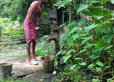 Tha naked Indian mature man shower in open place and showing body and dick..