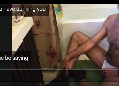 Guy Getting Dunked in a Tub.