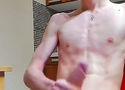 A young beautiful gay twink fucks a vibrator