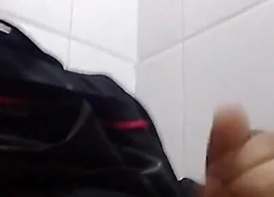Man Sits in the Bathroom