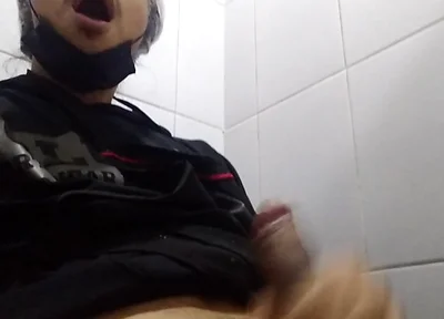 Man Sits in the Bathroom