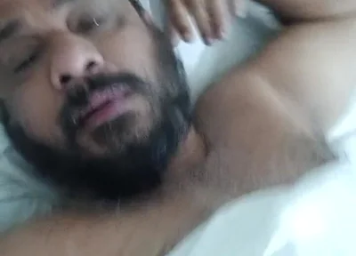 Indian Daddy Lying on the Bed Teasing and Posing for You
